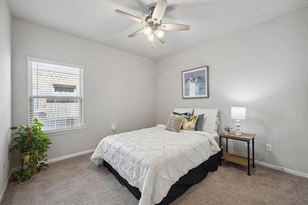 Charming 2nd Bedroom with new ceiling fan.