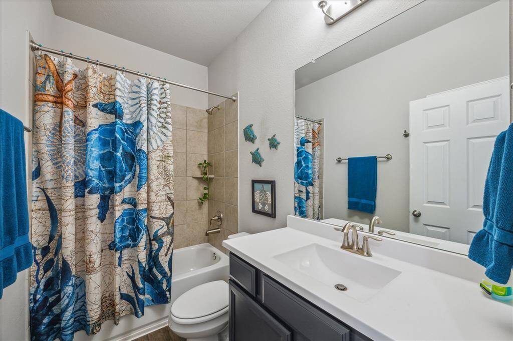 Second bath with gorgeous cabinets and vanity space.