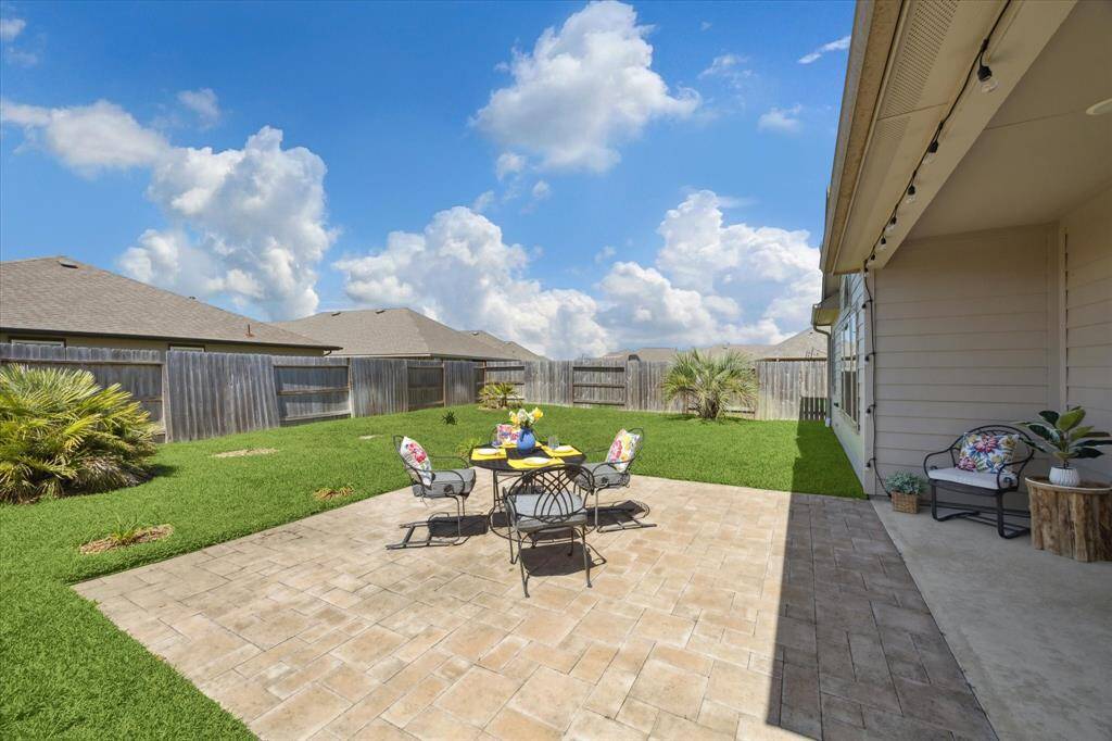 Extended paver-stone patio with plenty of space to design your perfect oasis and entertain guests.
