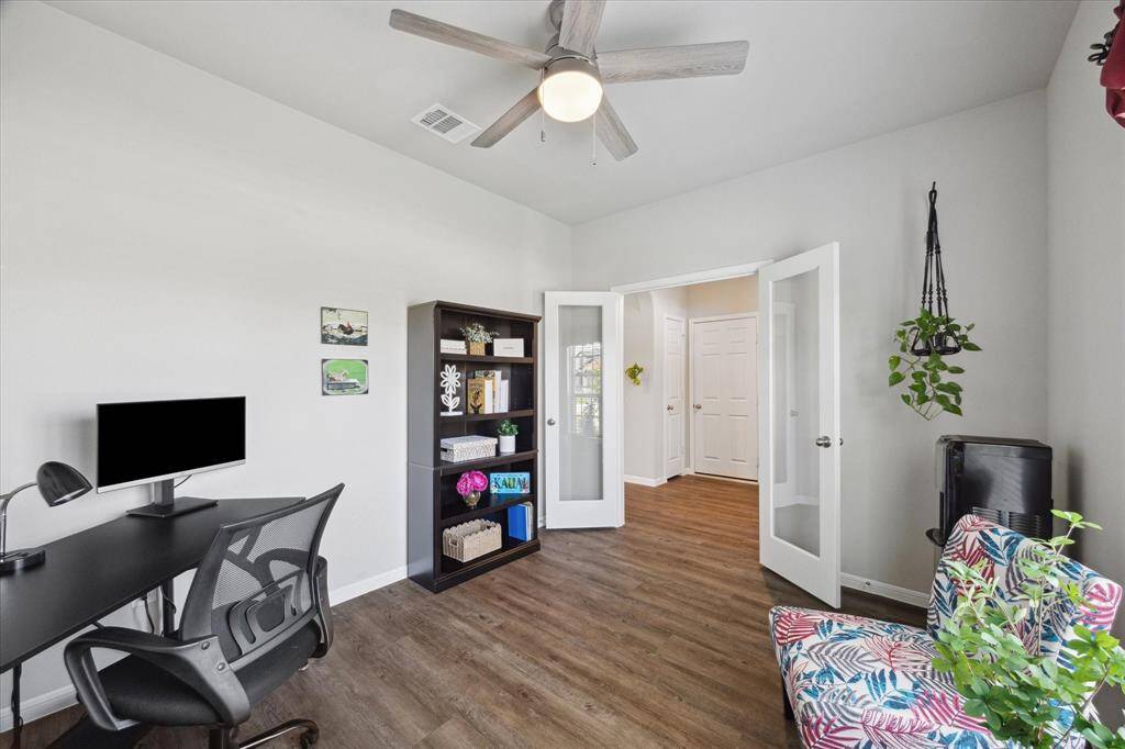Versatile Home Office could easily convert to a separate living space!