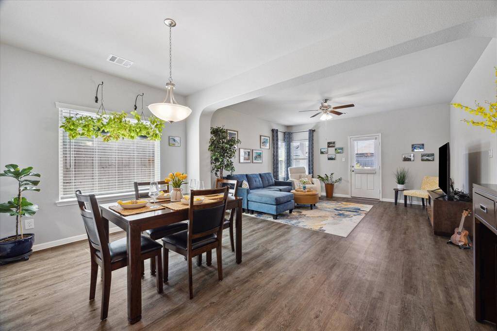 Cheerful Open Concept from Kitchen to Family Room makes dining and entertainment convenient and enjoyable!