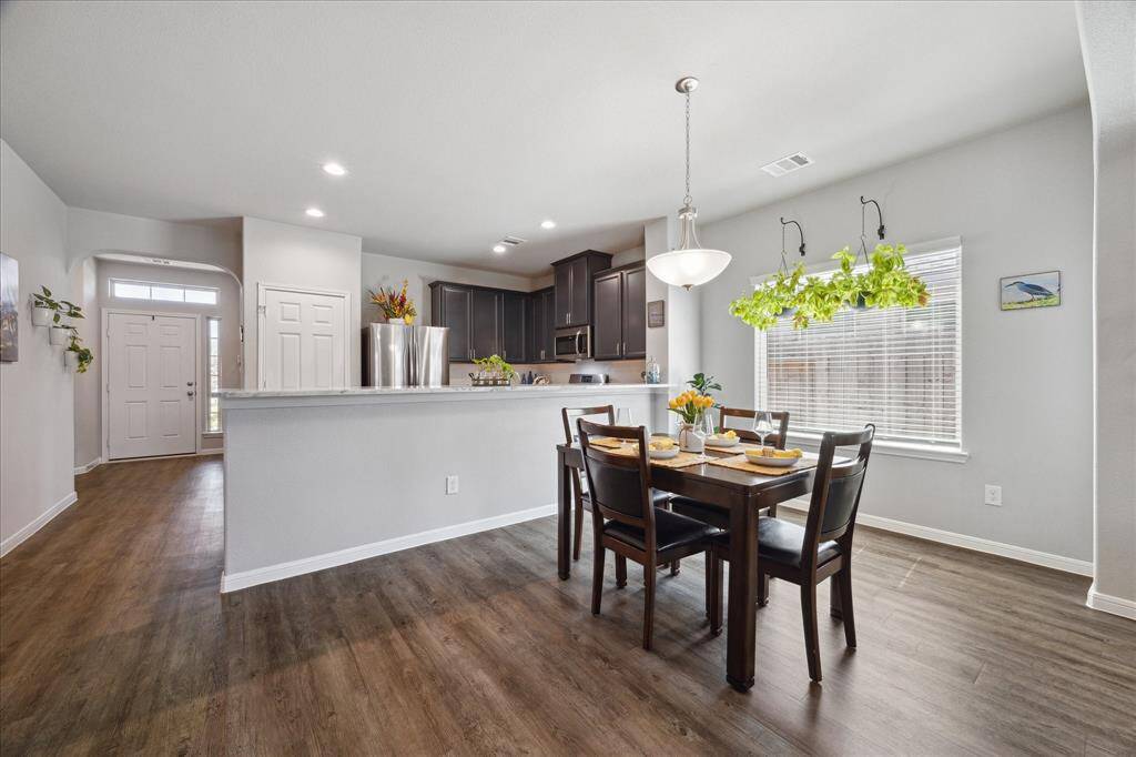 Spacious Dining Area with convenient Breakfast Bar.