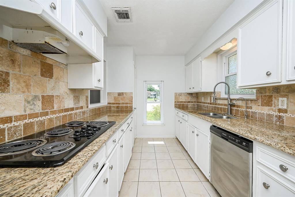 The space is brightened by natural light from a window, offering a clean and functional layout.