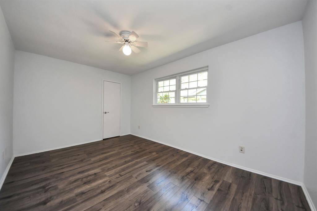 Just as the previous bedroom, bedroom 2 is freshly painted and features a ceiling fan along with a walk-in closet for ample storage.