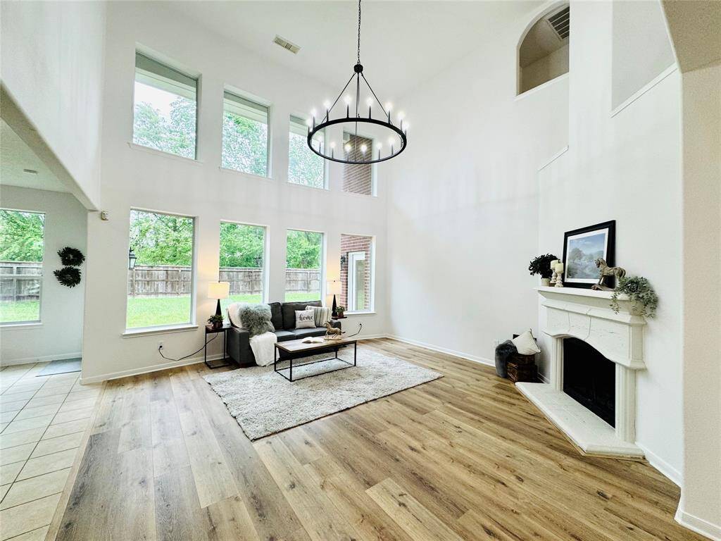 The family room is a showstopper with a two story ceiling, lower and upper double pane Low E windows, and a fabulous gas connection fireplace!