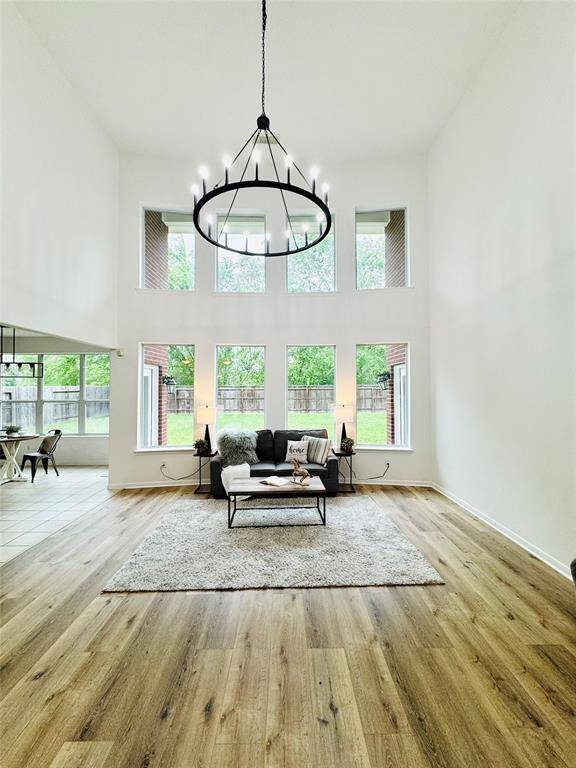 Such an amazing space with updated chandelier (2024), updated LVP wood flooring (2024), double pane Low E windows, and updated wall and trim paint (2024)! What an open and inviting space!