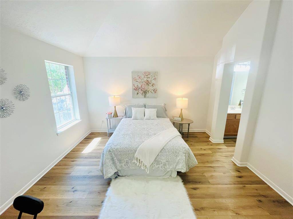 This room has updated LVP wood flooring (2024), and updated wall and trim paint (2024)! And it has it's own personal vanity!