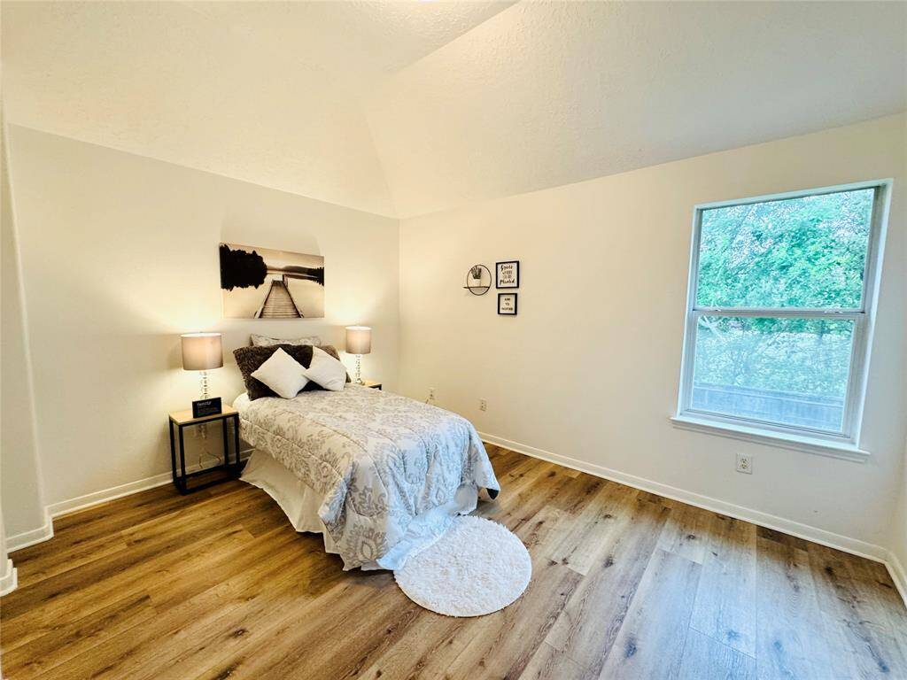Bedroom #3 is off of the back of the home. It has This room has updated LVP wood flooring (2024), and updated wall and trim paint (2024)!