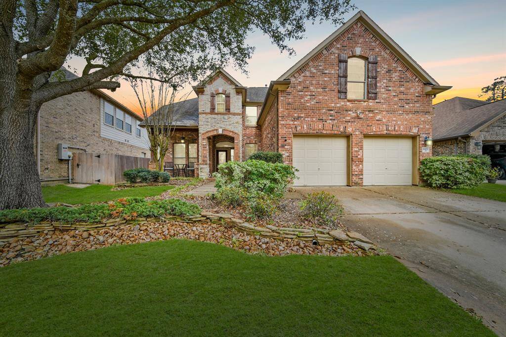 This captivating home boasts a grand curbside appeal and arrival experience - highlighting a beautiful brick and stone elevation, covered porch, and a beautiful array of windows.