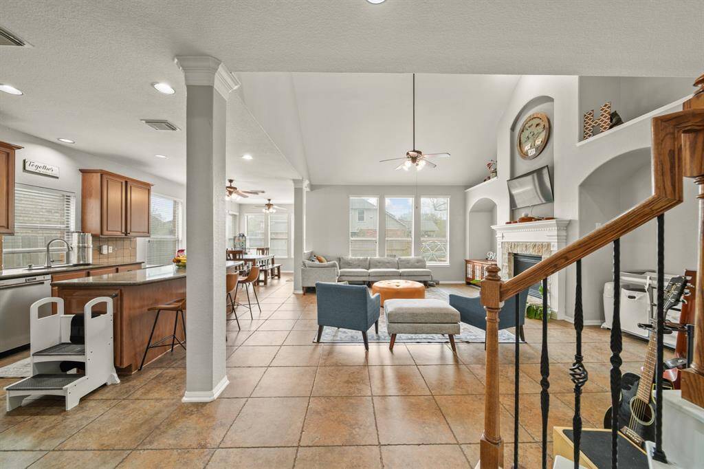 Walk through the foyer past the formal areas and the staircase and arrive at this incredible open floor plan.