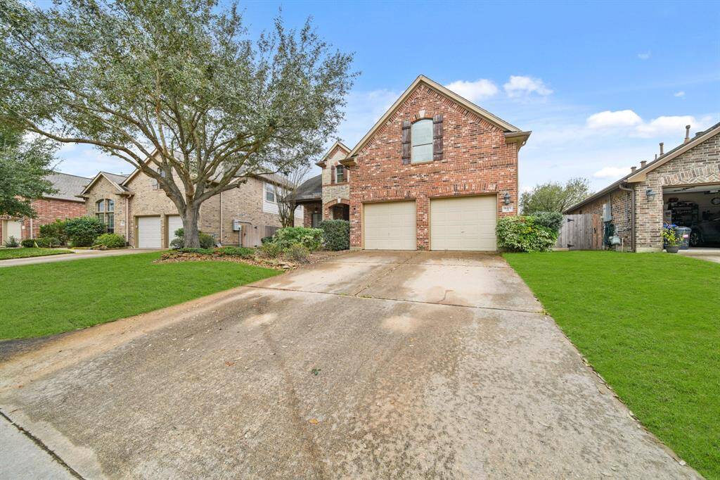 2-car garage with a long driveway.