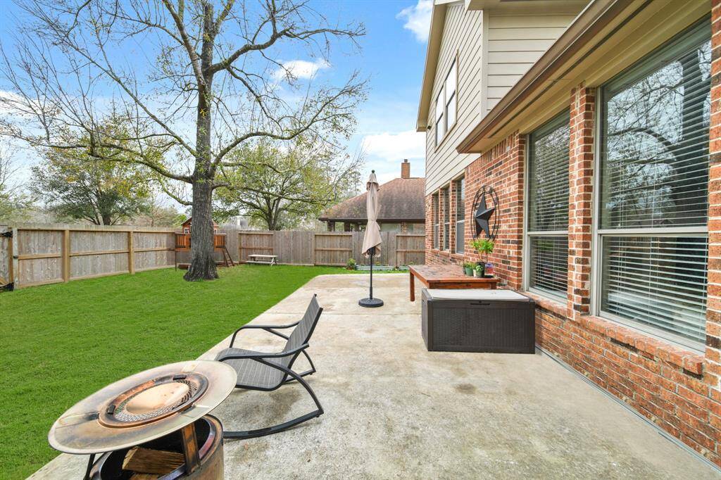 Kick back and relax on the backyard patio and enjoy the spacious lawn with plenty of room for that future pool.