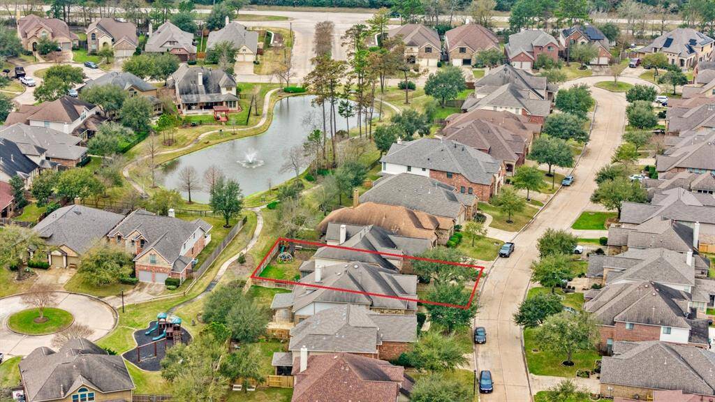This home is located in the tranquil subdivision of Coles Village with an artificial lake.