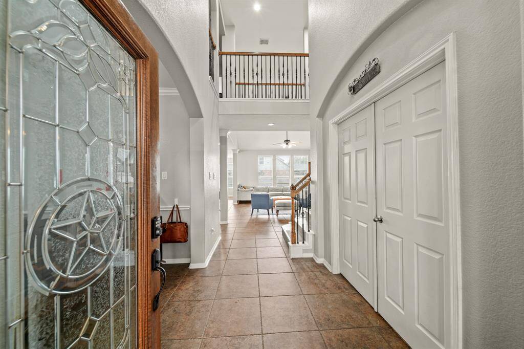 You'll be instantly greeted by beautiful tile floors, and a view straight back into the backyard!
