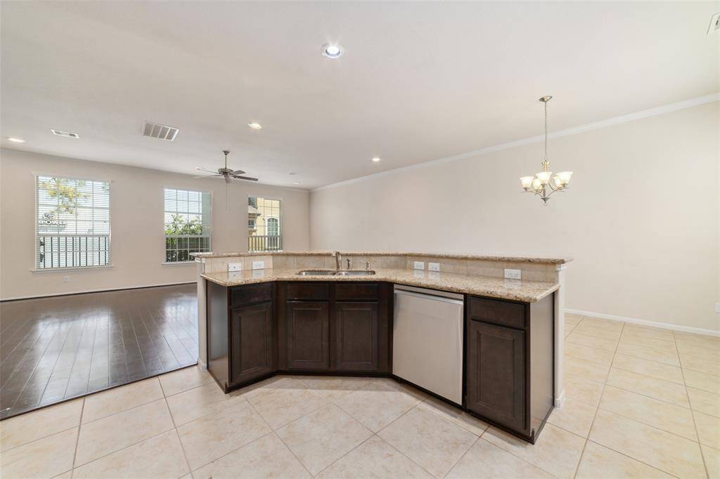 Large breakfast bar, open to the kitchen. Great natural lighting from the surrounding windows.