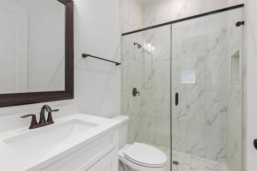 Bathroom 2 with upgraded glass walk-in shower