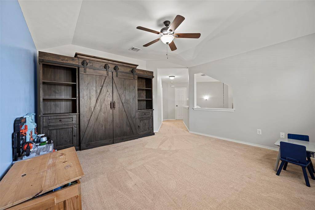 There is ample room for large furniture pieces too!  We love the layout of this home and how the game room is tucked off to the side away from the secondary bedrooms and has soft carpet under foot!