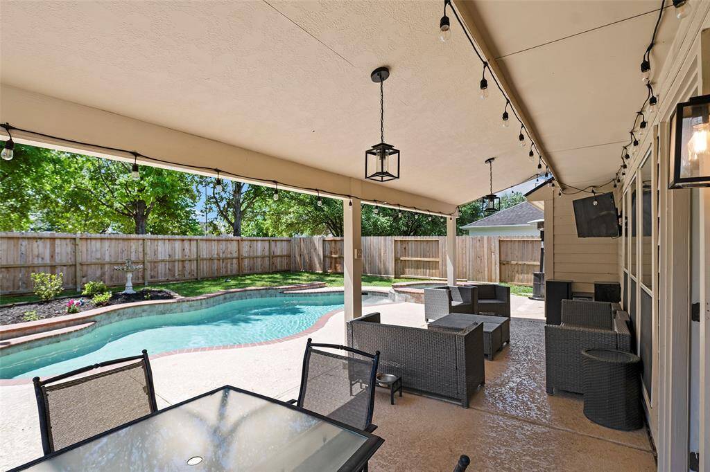 Let's open the door to the backyard oasis that will offer plenty of fun for years to come! A light filled covered patio with Kool deck will keep thing cools and active well into the night, with amazing views!