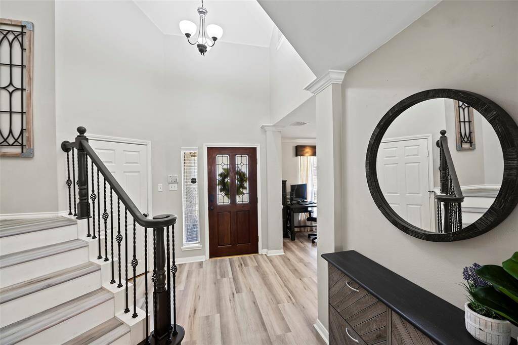 Open the door to a pretty entryway that is light and bright featuring luxury vinyl plank flooring that flows throughout the first floor, creating a beautiful, seamless look!