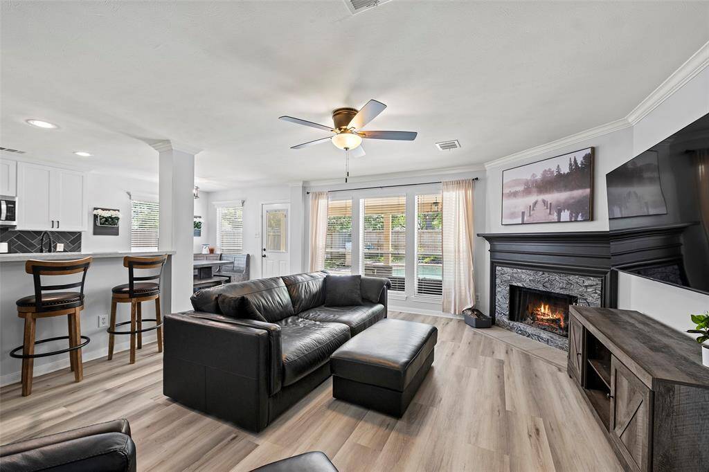 A spacious family room with corner fireplace that is the main focal point of the room! Imagine spending cool winter nights curled up on the couch with the roaring fire watching your favorite movie with loved ones!