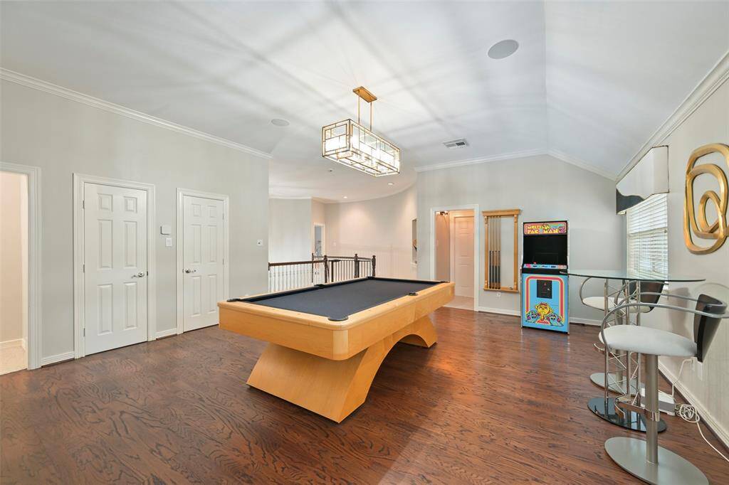 This spacious game room on the second floor features hardwood floors, windows overlooking the backyard and plenty of closet/storage space. Recessed lighting, and ample natural light in this room is perfect for entertainment and relaxation.