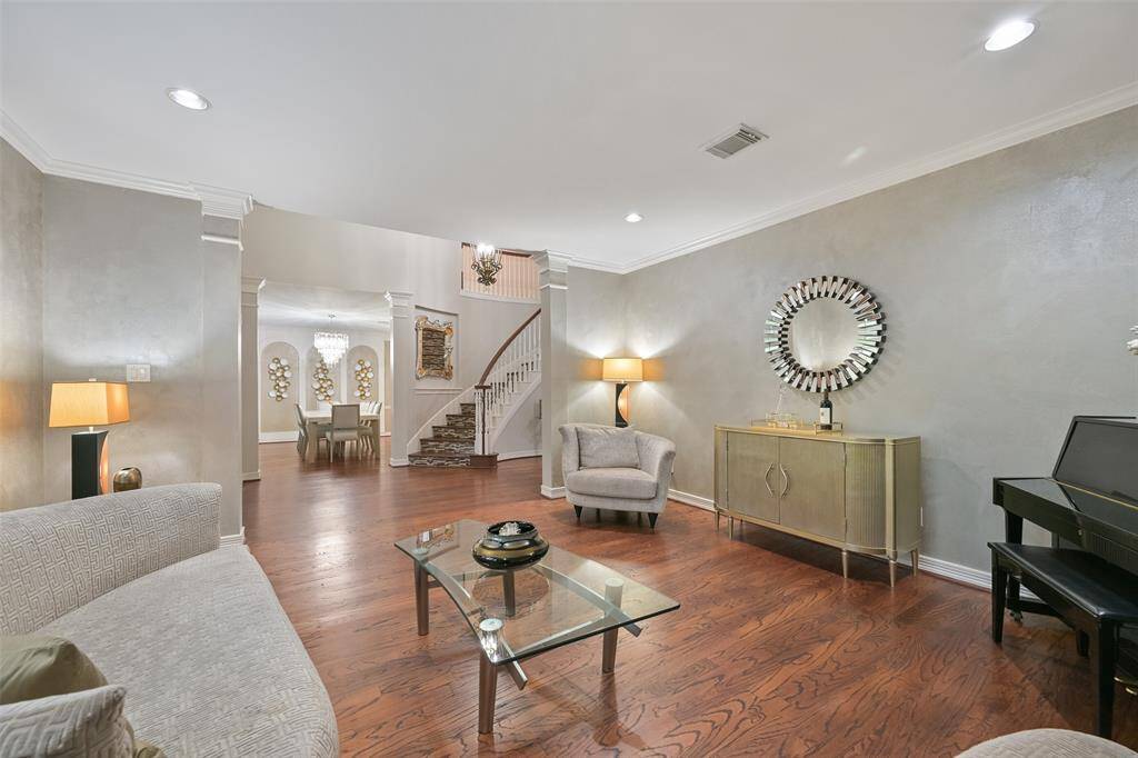 Another view of the elegant formal living room open to the entry and the spacious formal dining room.