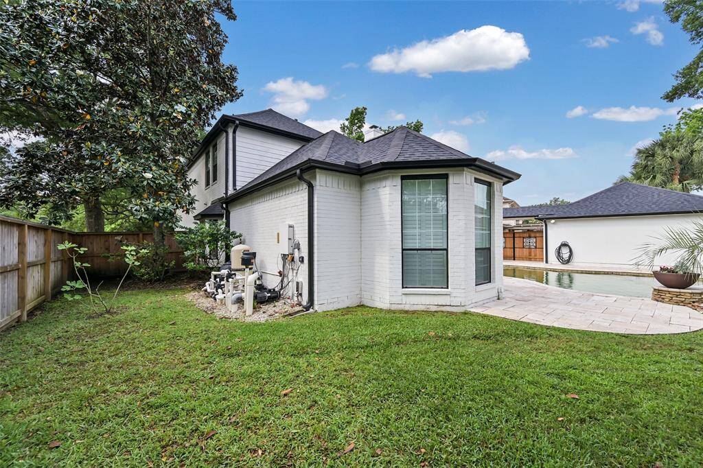 Extra green space along the side of the home offers added room for play, gardening, or relaxation.