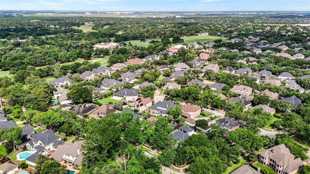 Aerial view of the home and its proximity to the Bay Oaks Country Club and golf course.