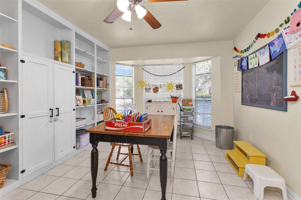 Dining room with wall of built-ins used as a home office