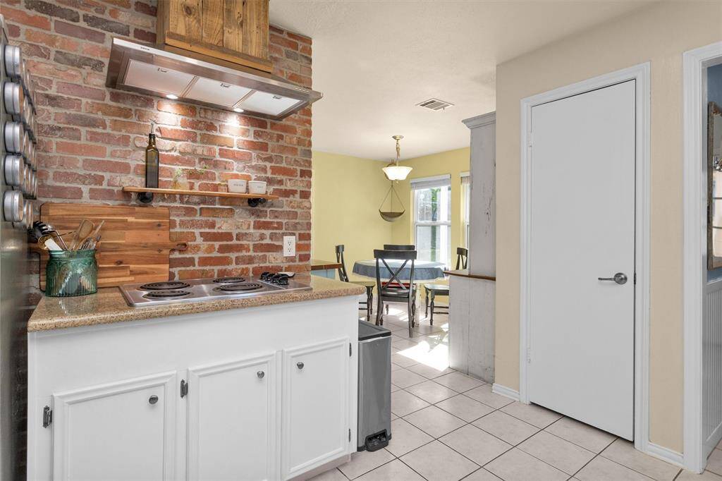 Brick feature wall. Pantry to the right