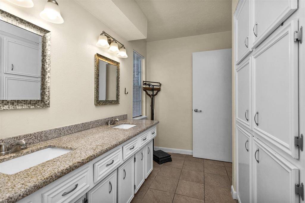 Hall bathroom upstairs has double sinks