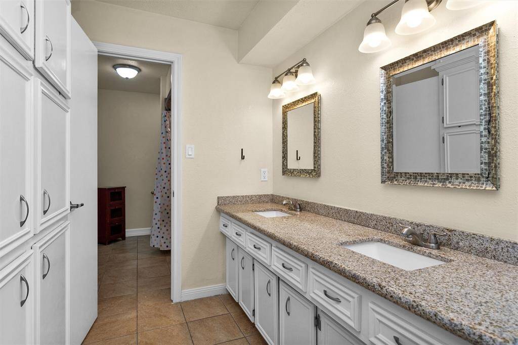 Updated vanity area. Wall of cabinets!
