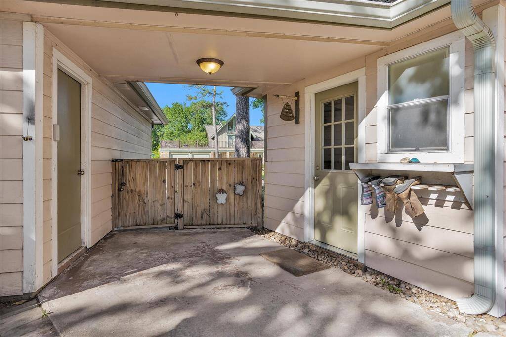 Covered walk-way between house and garages