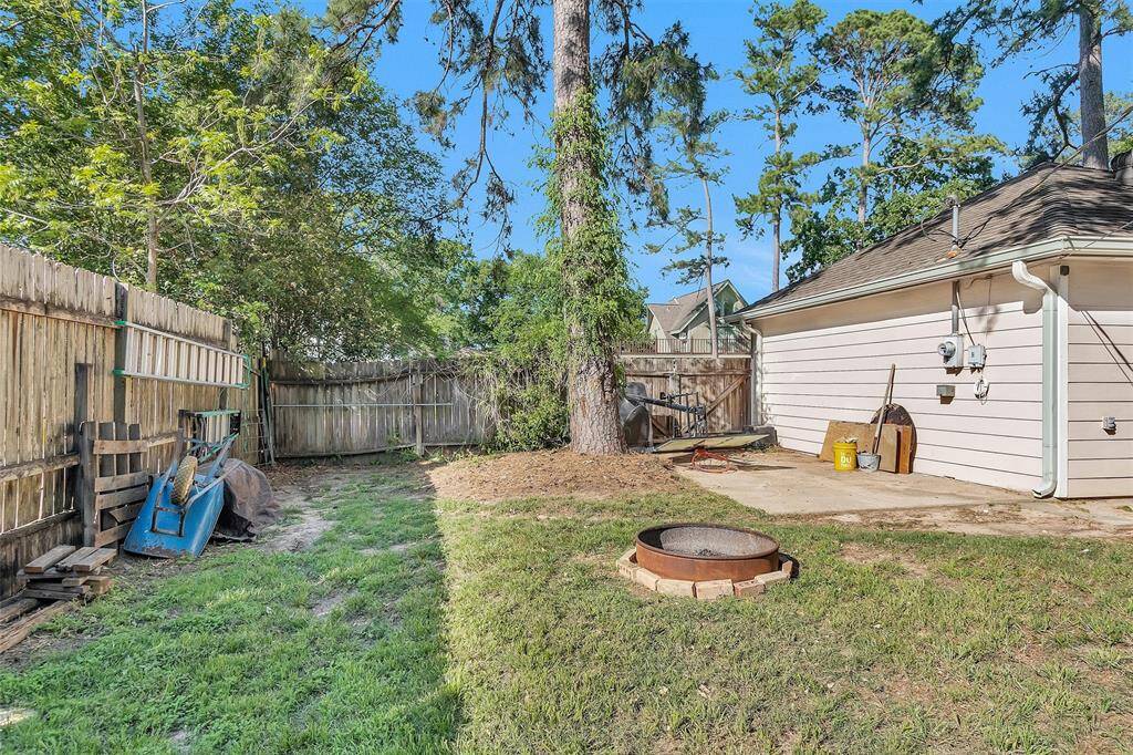 Double gates to back yard on the side of the garage