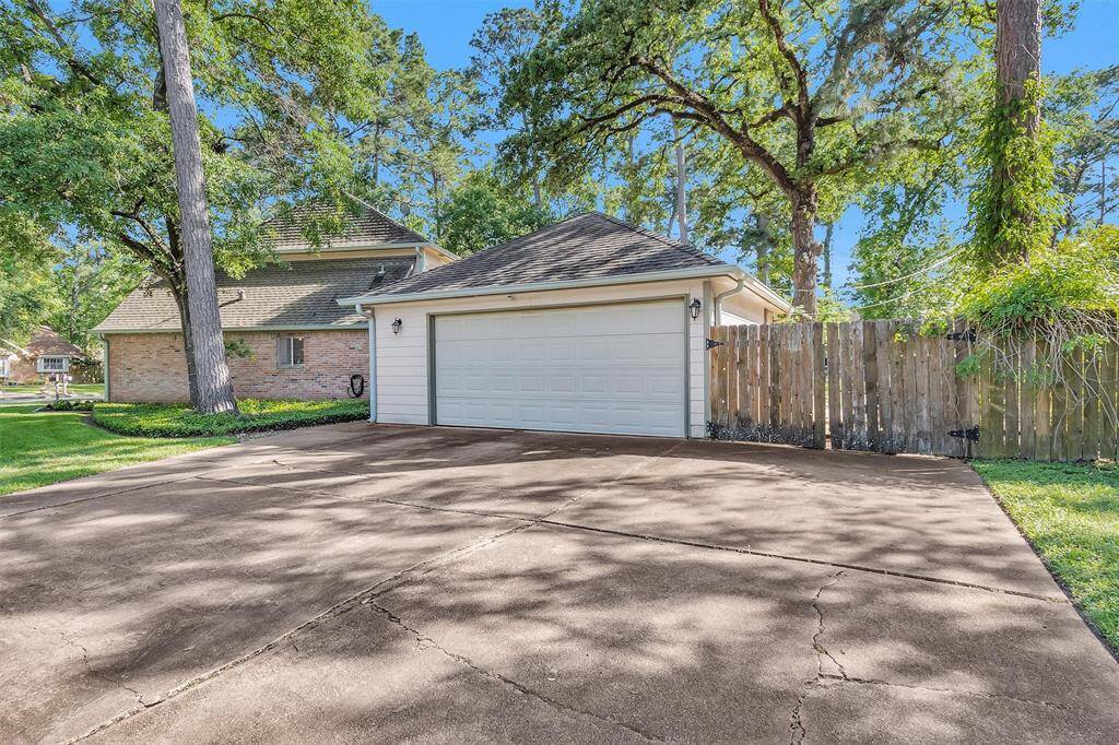Extended driveway allows for 3 cars to park. Double gates to back yard