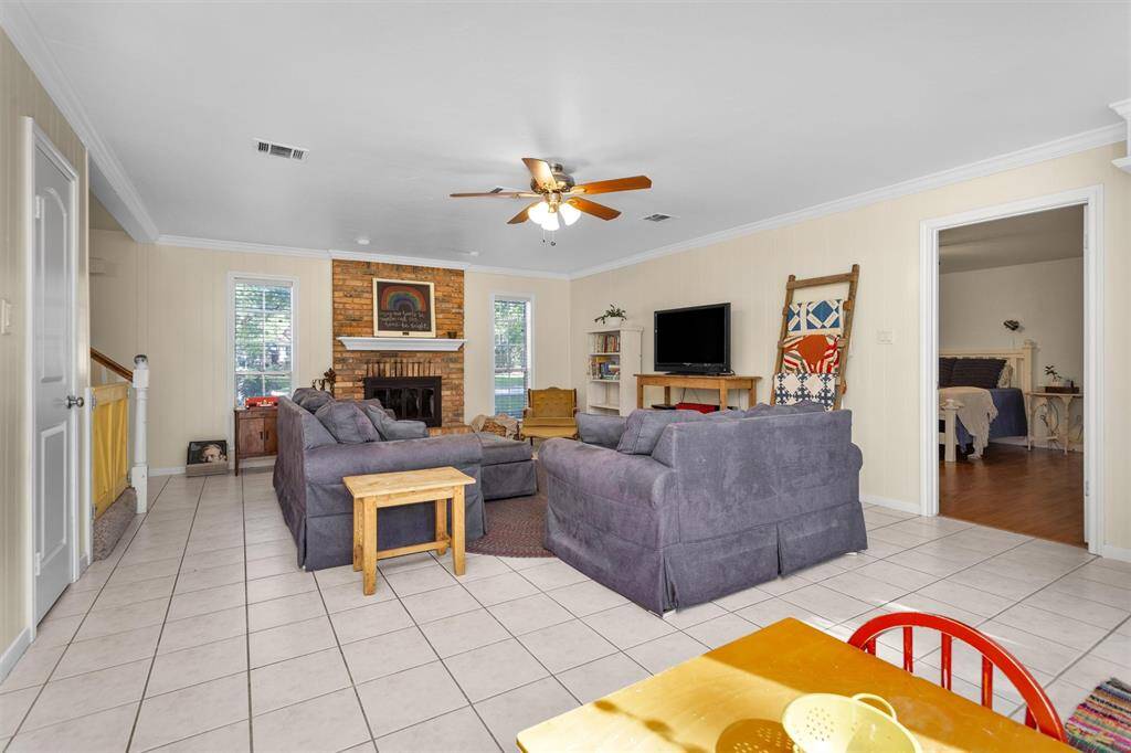 Central living room spans the entire width of the home