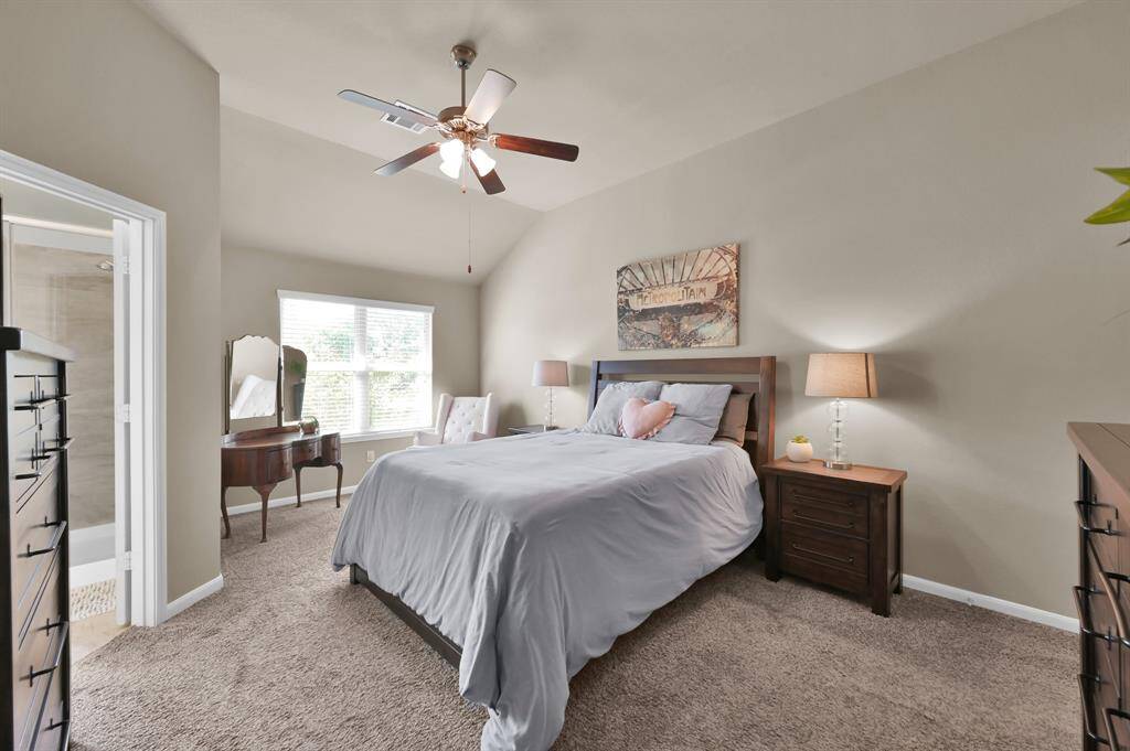 Another view of the primary bedroom