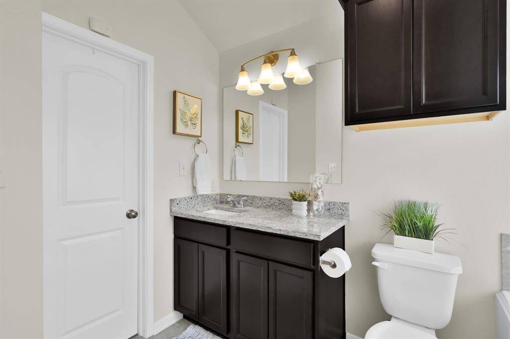 Primary bathroom.  Door pictured is a large walk in closet
