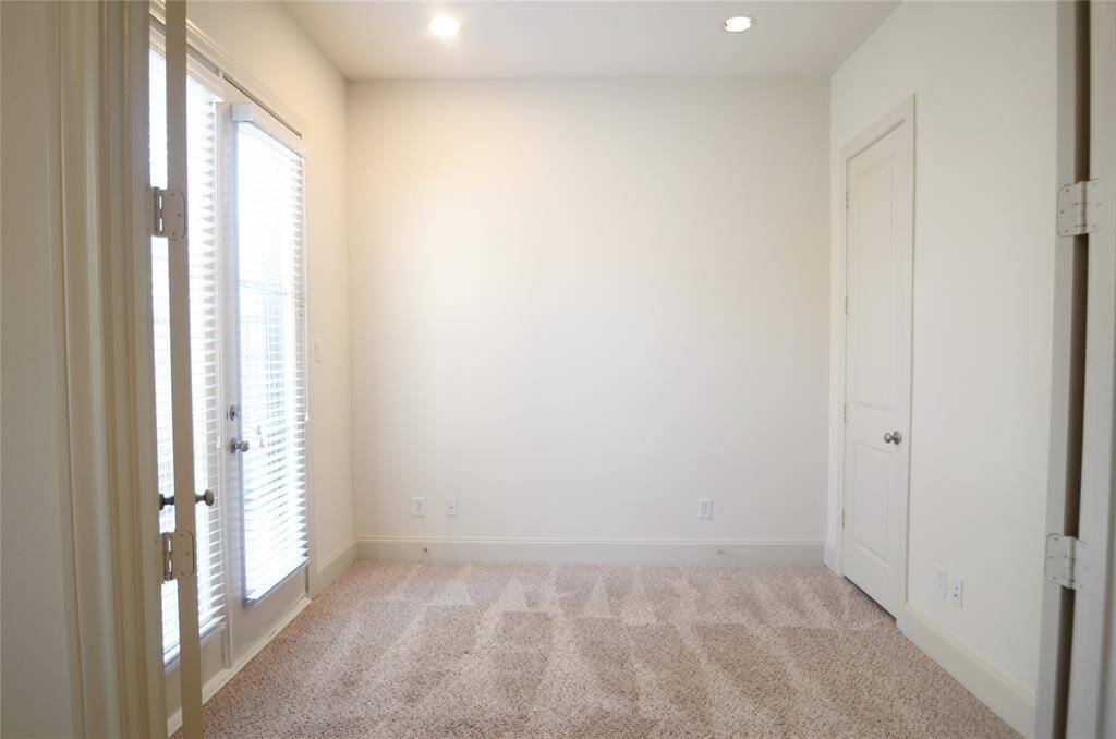 Office off of the guest suite downstairs, and backyard entrance on the left.