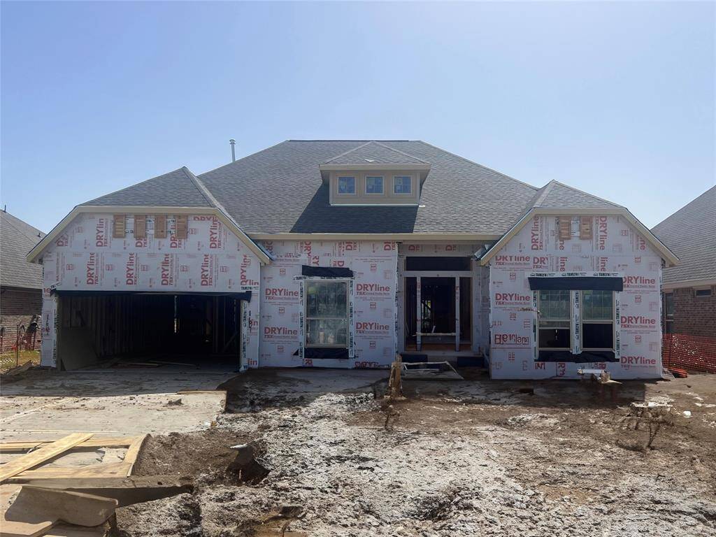 One-story home with 4 bedrooms, 3 baths and 3-car tandem garage