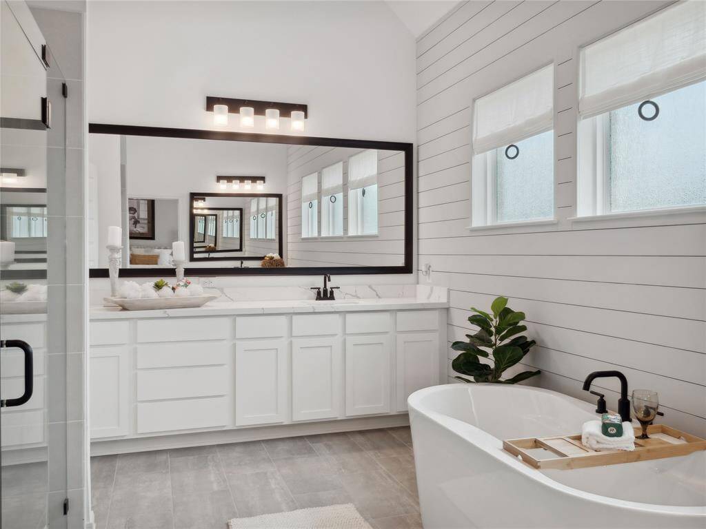 Dual sinks, separate shower and tub in owner's bath (*Photo not of actual home and used for illustration purposes only.)