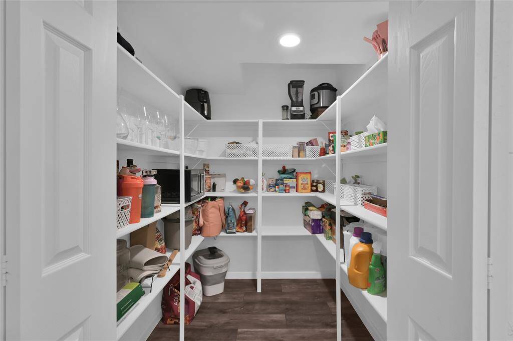 In addition to all the kitchen cabinetry, this AMAZING pantry with light provides A LOT of storage space for all your food items, even the oversized items from Costco. Double doors give you a wider than usual opening.
