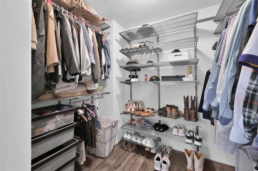 Organizing all your clothes is easy with your very own Container Store Closet System with a barn door closure.