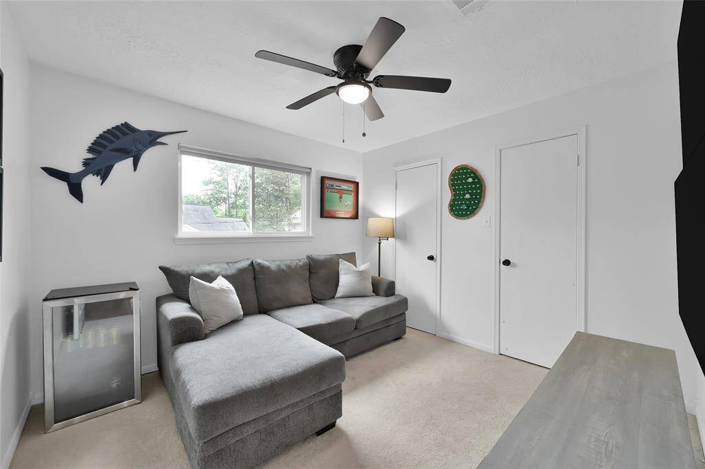 This Secondary Bedroom also overlooks the Back Yard and has a wide closet with two door access along with a ceiling fan and light. It has recently replaced carpet.