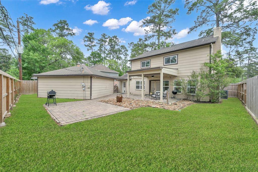 There is still plenty of lawn area for pets and playing without too much to mow. Fencing with rot board has been replaced over the last few years. The back of the home also has gutters.