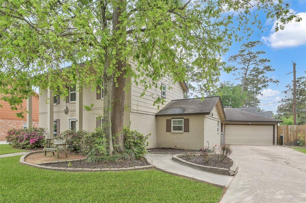 An oversized two-car Garage has an extra storage area and open rafters for additional storage. There is a covered breezeway connecting the Garage to the back door at the Laundry Room.