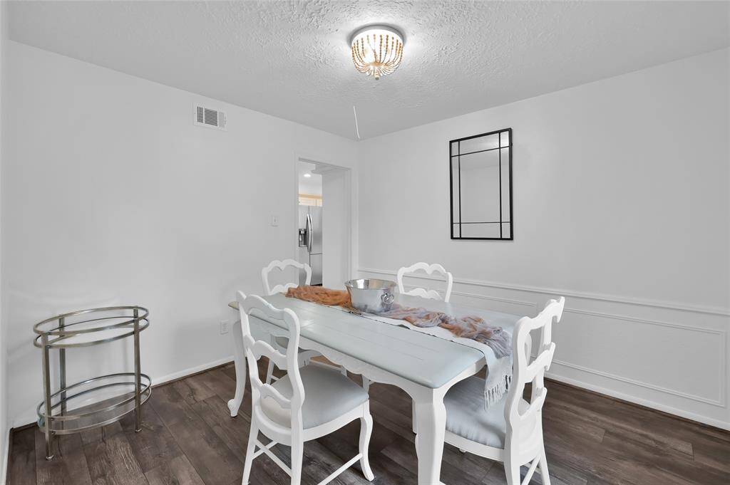 To the right of the Foyer is the Formal Dining Room and connects to the Kitchen. This room could easily be used for other activities like a play room or additional office.