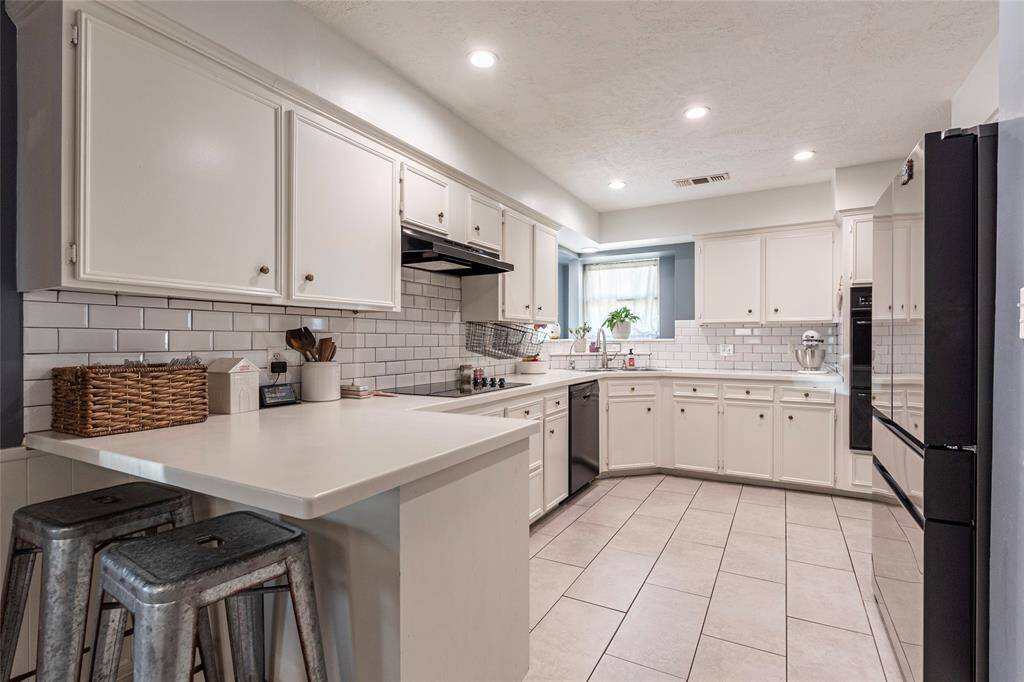 Kitchen with recessed lighting...