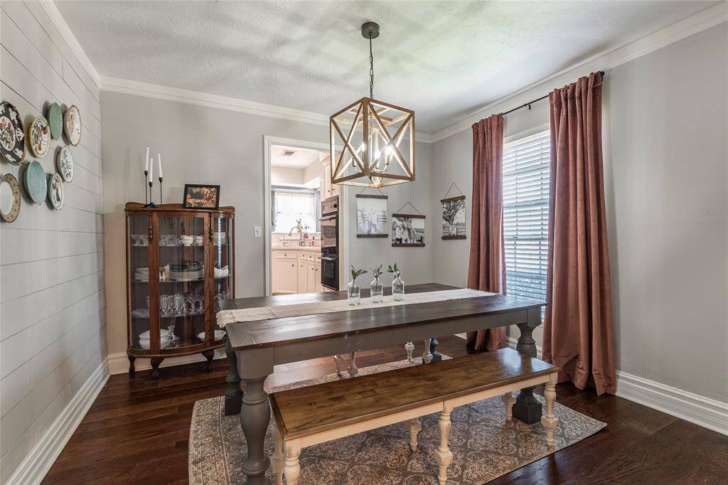 Dining with shiplap wall and updated light fixture