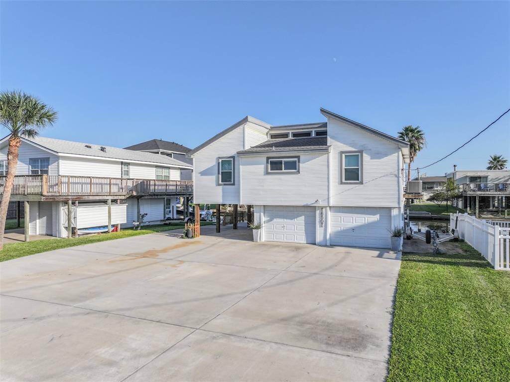 Extra space for a boat or jet ski is available on the right side of the home.